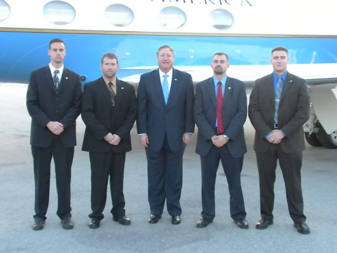 AFOSI agents helped protect the Secretary of the Air Force on his way to Monterey. Shown in the picture are: (left to right) SA Rich Plummer, Region 7, 1st Field Investigative Squadron, Travis AFB, Calif.; SA Jim Collins, Det. 303, Travis AFB, Calif.; Secretary of the Air Force Michael B. Donley; SA Alex Poggio, Det. 303; and Kris Troop, Det. 303. ((U.S. Air Force photo)