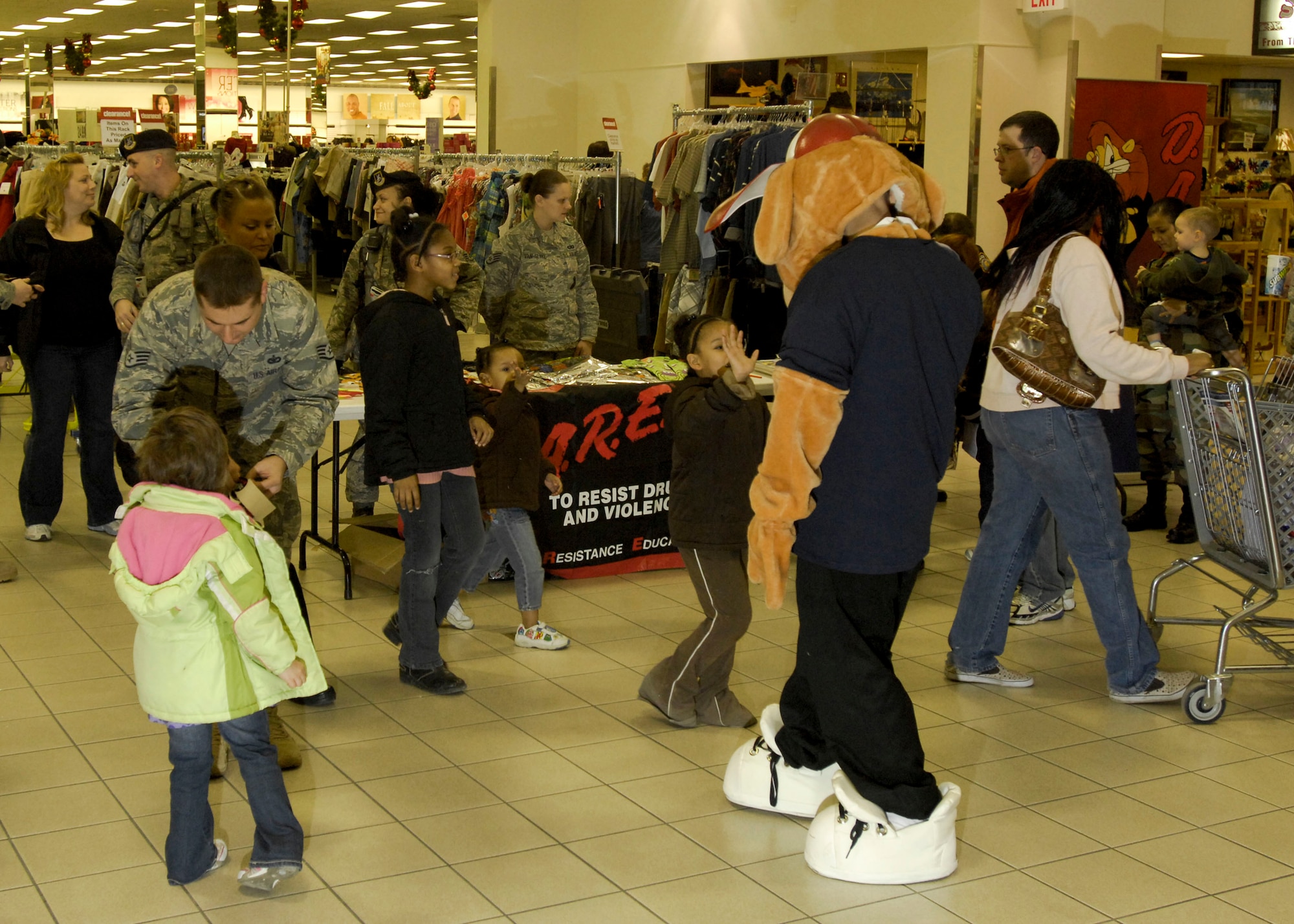 ELMENDORF AIR FORCE BASE, Alaska – Members of the 3rd Security Forces Squadron and the Drug Abuse Resistance Education team passed out Halloween treats to children Oct. 30 at Elmendorf’s Base Exchange. (U.S. Air Force photo/Airman 1st Class Christopher Gross)