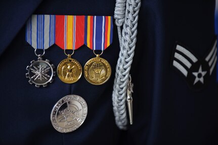 Highly polished medals and badges display the high level of professionalism and precision of an Air Force Honor Guard Drill team member. (U.S. Air Force photo/Steve Thurow)