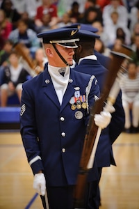Staff Sgt. Kelly Webster, member of the U.S. Air Force Honor Guard Drill Team, spins his M-1 Garand rifle with a fixed bayonet during a performance of Air Force precision and professionalism for the Ro-Hawks of Randolph High School Nov. 2. (U.S. Air Force photo/Steve Thurow)
