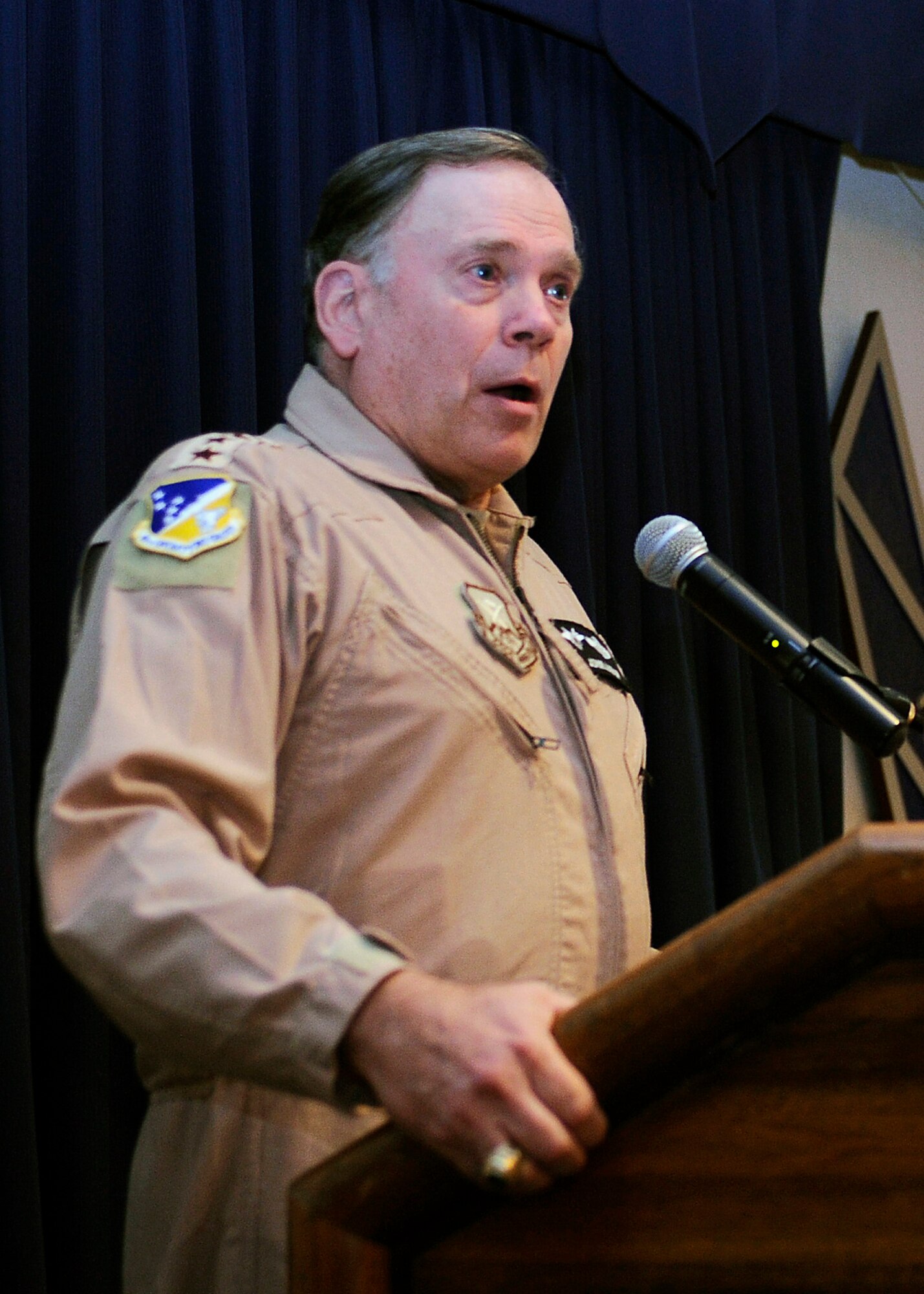 HOLLOMAN AIR FORCE BASE, N.M. -- Gen. John Jumper, retired Chief of Staff of the Air Force, shares his life-long journey within the Air Force during a Warrior Call here, Oct. 30. Members of Team Holloman watched as General Jumper described his experiences in the military and how he became Chief of Staff of the Air Force. (U.S. Air Force photo by Airman 1st Class Veronica Stamps)