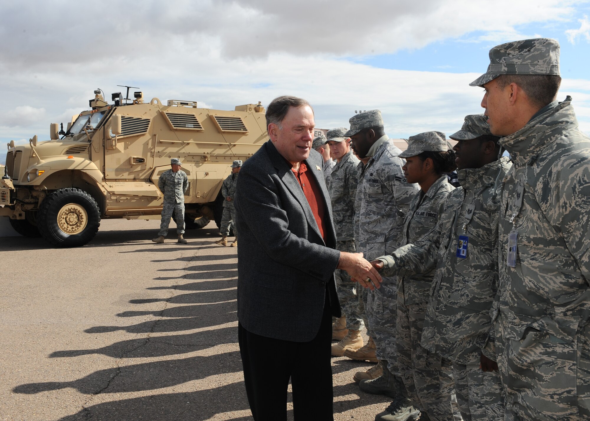 HOLLOMAN AIR FORCE BASE, N.M. -- Gen. John Jumper, retired Chief of Staff of the Air Force, thanks Airmen from the 49th Materiel Maintenance Group for their hard work here, Oct. 29. While visiting Basic Expeditionary Airfield Resources base, General Jumper also climbed inside the Mine Resistant Ambush Protected vehicle and viewed other deployment-ready equipment that was demonstrated by BEAR base Airmen. (U.S. Air Force photo by Airman 1st Class Veronica Stamps)