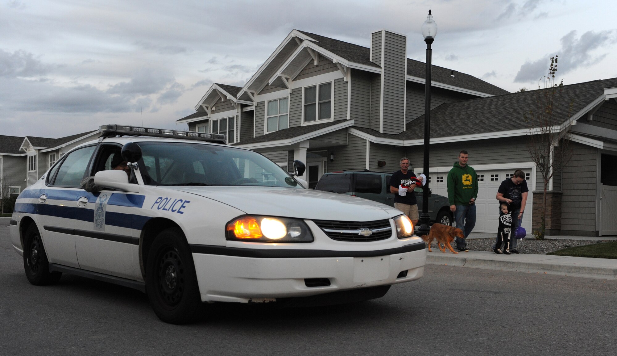 MOUNTAIN HOME AIR FORCE BASE, Idaho -- A 366th Security Forces Sqaudron patrol car circles a neighborhood while they monitor children and families trick-or-treat in base housing Oct. 31. The 366th SFS conducts a pumpkin patrol on base each year to ensure the safety of children and their families as they trick-or-treat and celebrate Halloween. (U.S. Air Force photo by Airman 1st Class Debbie Lockhart)
