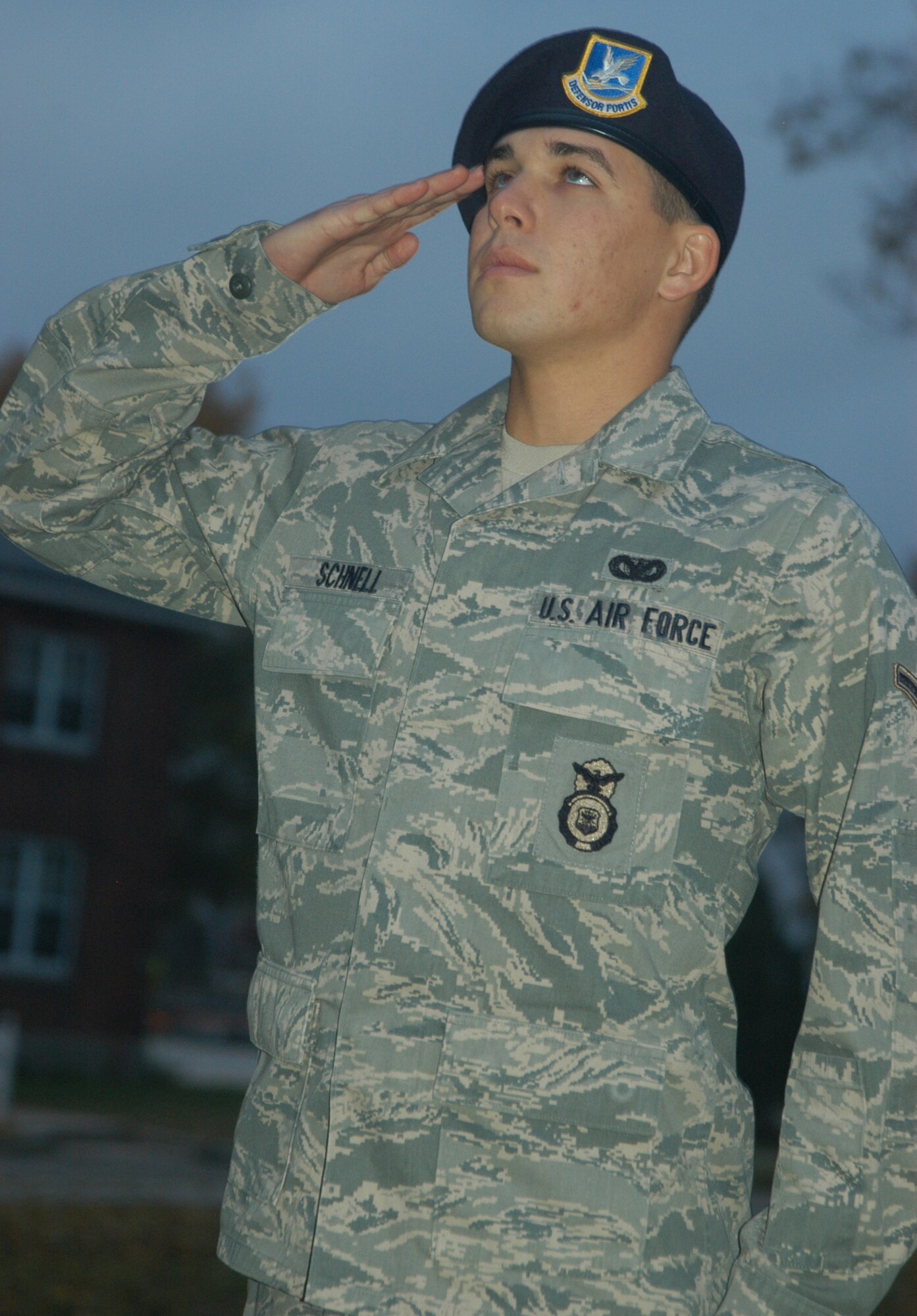 OFFUTT AIR FORCE BASE, Neb. - Airman Jared T. Schnell, 55th Security Forces Squadron, salutes Old Glory as the flag is raised at the parade grounds here Oct. 28. Airman Schnell was part of a morning detail responsible for removing strings from all 26 flags that fly at Offutt's parade grounds. Airman Schnell said it's important to ensure the American flag is well taken care of as it represents freedom and the sacrifices of all servicemembers past and present. U.S. Air Force Photo by Staff Sgt. James M. Hodgman