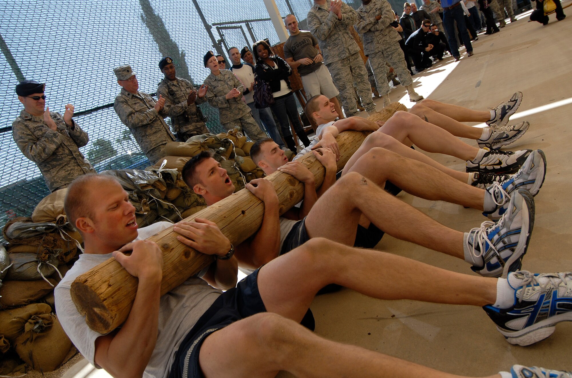A four-man team from the 56th Security Forces Squadron demonstrate some hard-core techniques in the newly-minted Combat PT Course on Luke Air Force Base, Ariz.  (U.S. Air Force photo by Tech. Sgt. Jeffrey A. Wolfe)