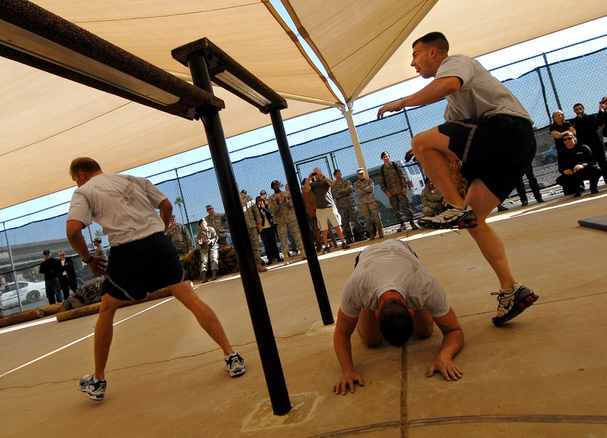 Members of the 56th Security Forces Squadron complete the inaugural run through the newly-minted Combat PT Course on Luke Air Force Base, Ariz.  (U.S. Air Force photo by Tech. Sgt. Jeffrey A. Wolfe)