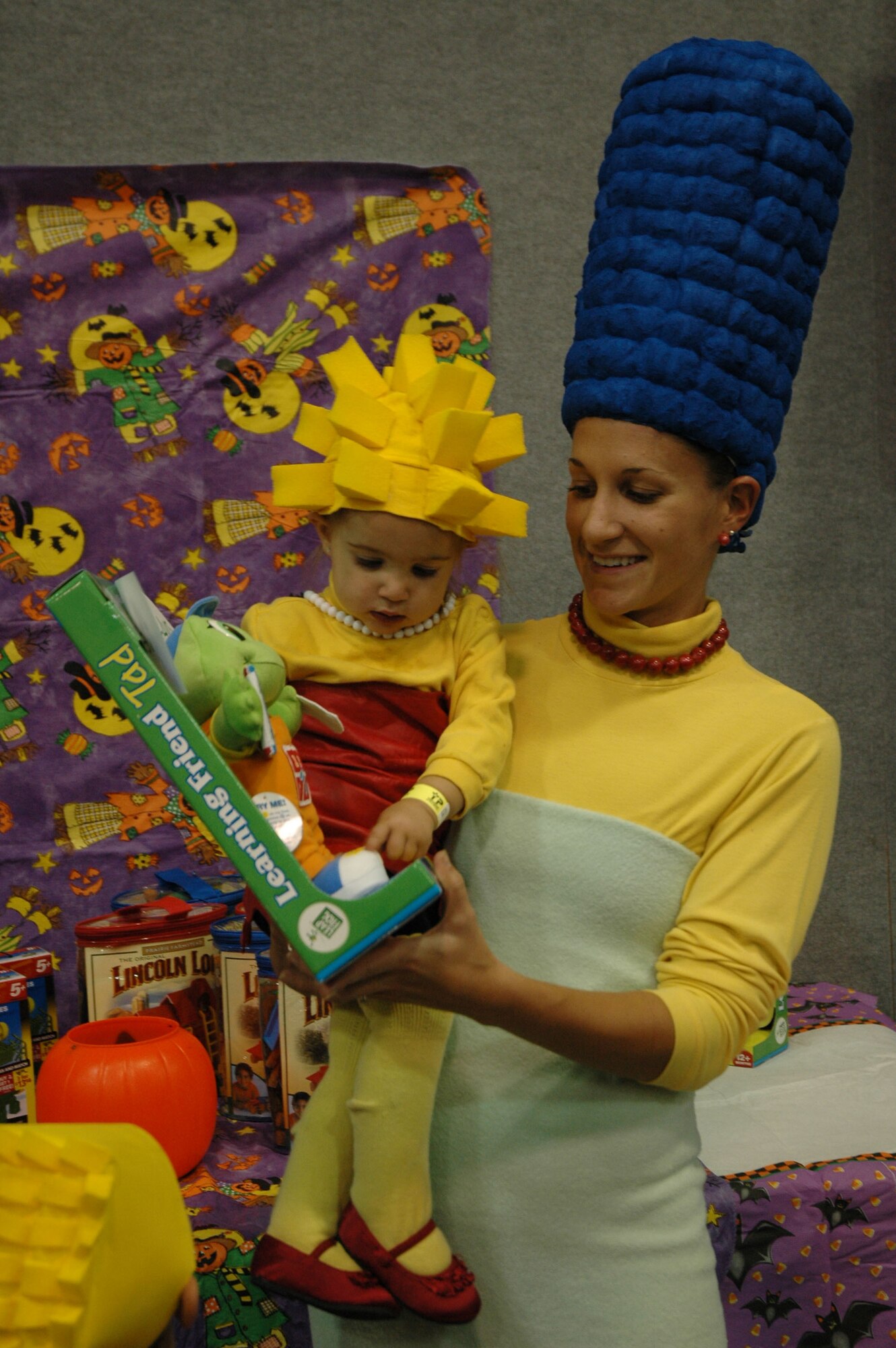 Lisa Broussard and 18-month-old Sophia, dressed up as Marge and Lisa Simpson for the Youth Center's Fall Festival Oct. 30. (U.S. Air Force photo/Senior Airman Dillon White)