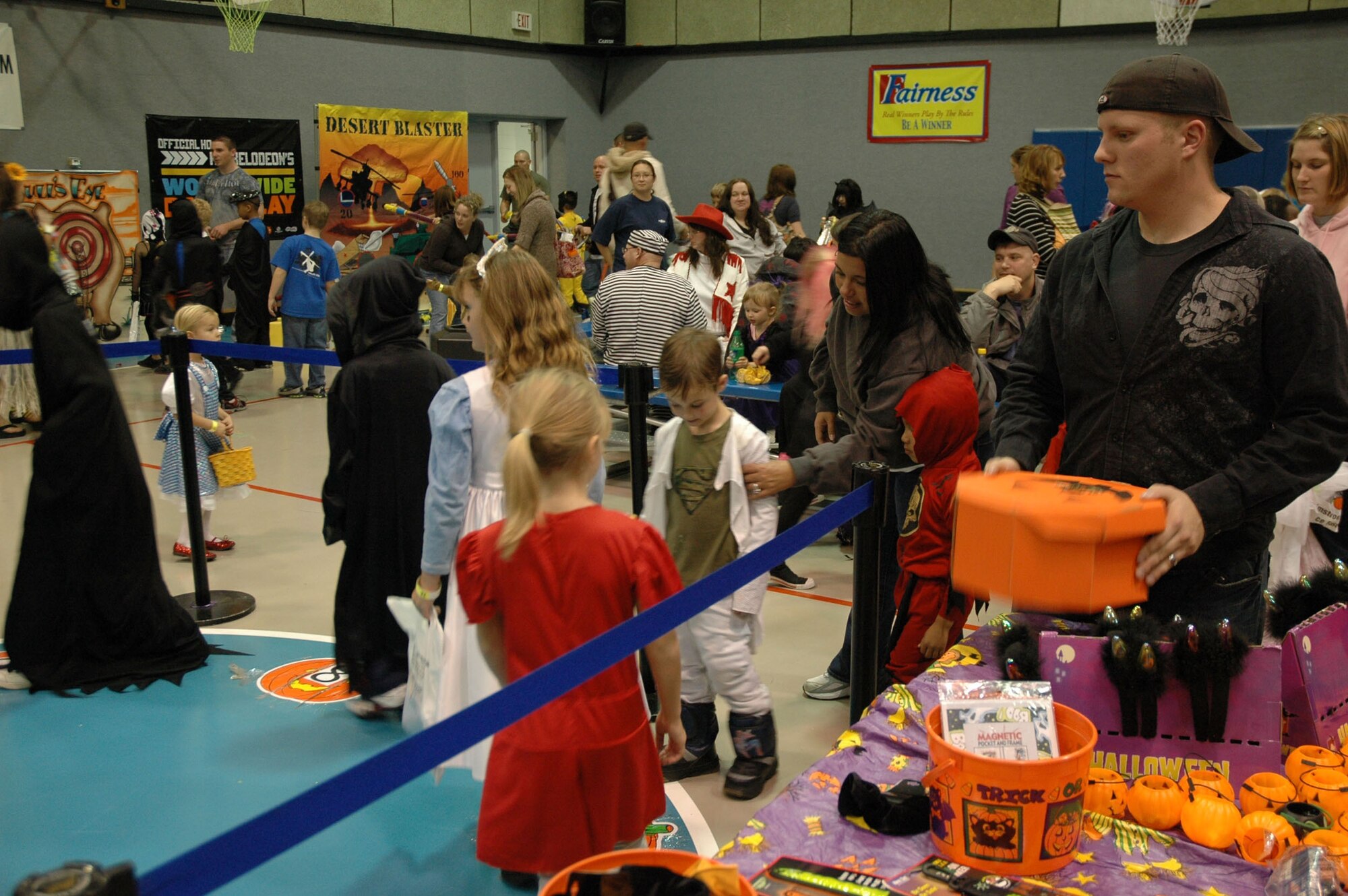 Senior Airman Jason Daniels, 341st Security Forces Group Tactical Response Force member, mans the musical pumpkins game at the Youth Center's Fall Festival Oct. 30. (U.S. Air Force photo/Senior Airman Dillon White)