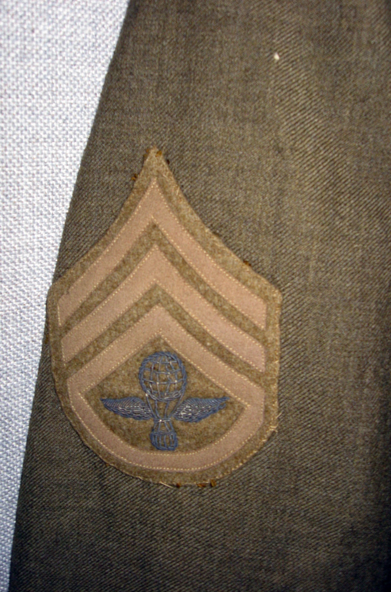 This service coat belonged to William Aulwes who served in World War I. Note the unique balloonist insignia embroidered on the rank chevron. (U.S. Air Force photo)