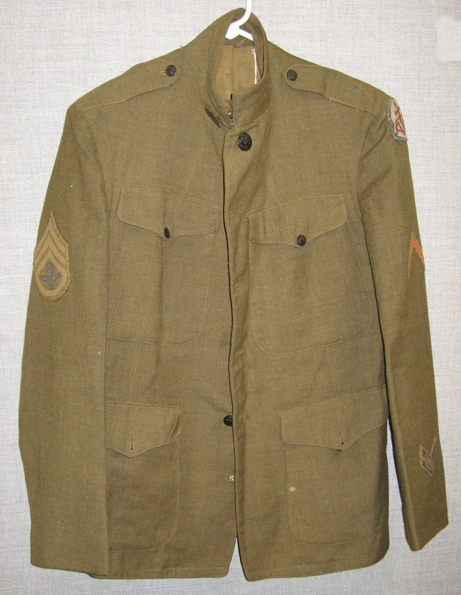This service coat belonged to William Aulwes who served in World War I. Note the unique balloonist insignia embroidered on the rank chevron. (U.S. Air Force photo)