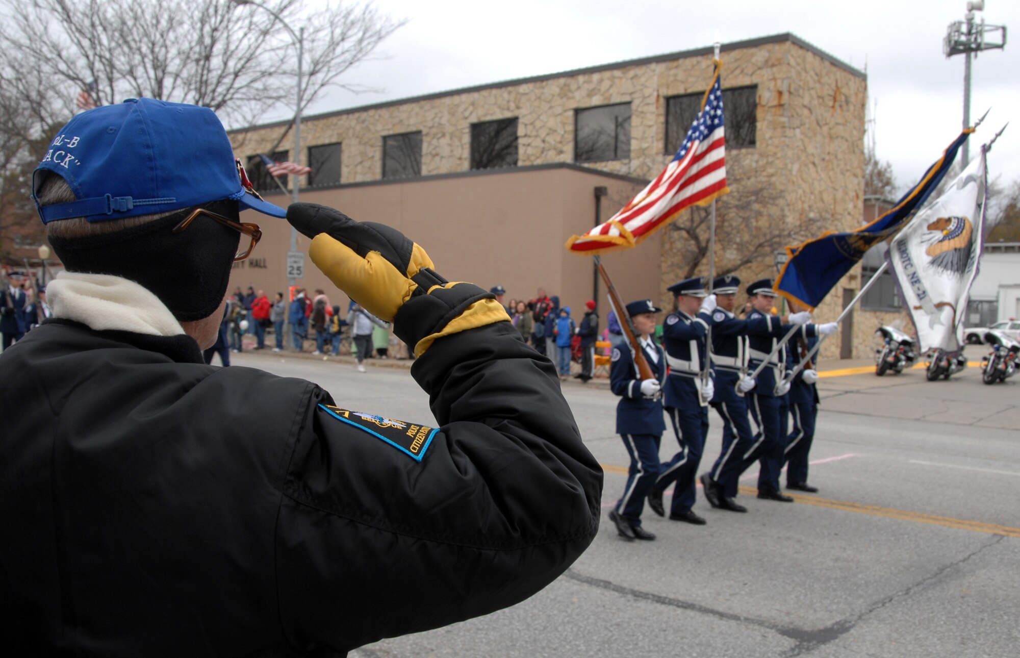 OFFUTT AIR FORCE BASE, Neb. - Retired Master Sgt. Hap Engelkamp, salutes the colors, presented by the Bellevue East Air Force Junior ROTC, as they make their way down Mission Avenue as part of the 2008 Nebraska Veterans Day Parade. The 2009 parade is set to begin at 10 a.m. Nov. 7 in Olde Towne Bellevue.

U.S. Air Force photo by Josh Plueger