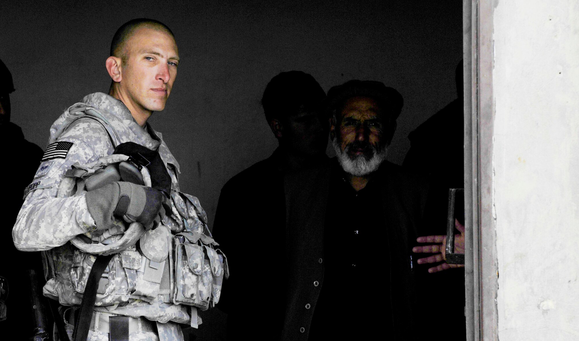 Staff Sgt. David Popp meets with Afghan prison officials during a mentoring session Oct. 28, 2009, in Qalat, Afghanistan. Sergeant Popp, a security forces Airman assigned to the Zabul Provincial Reconstruction Team, is deployed to the region from Creech Air Force Base, Nev. He works with the guards, helping them become better at handling prisoners within the compound. The mission is just one of many the PRT takes on, which can range from foot patrols to working with government officials. (U.S. Air Force photo/Tech. Sgt. Joseph Kapinos) 