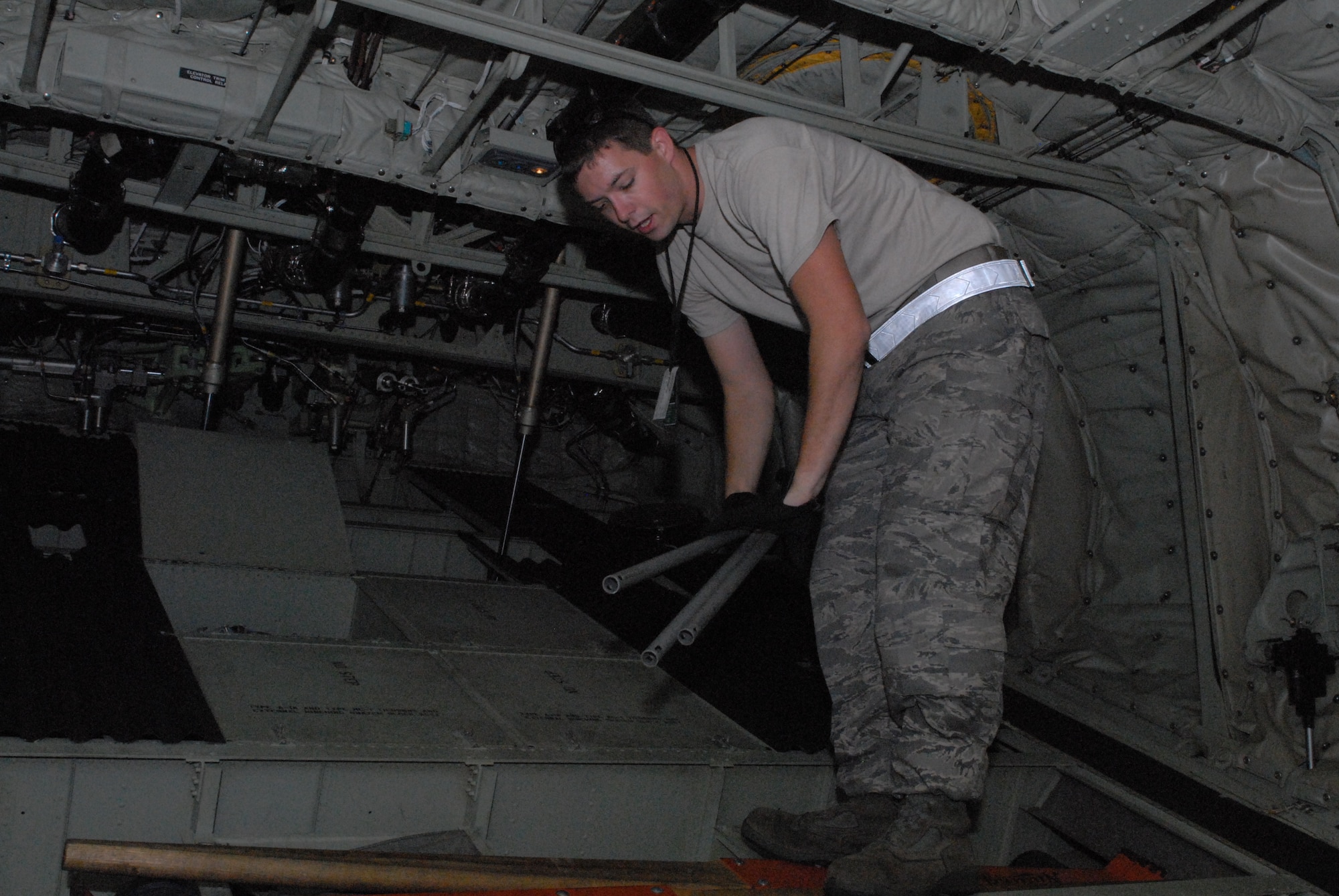 Senior Airman William Heptig, 19th Aircraft Maintenance Squadron crew chief from Little Rock Air Force Base, Ark., stows jump cables during the pre-flight maintenance of a C-130J Oct. 28 as part of a joint force exercise at Pope AFB, N.C. The JFEX focused on cohesive training between the Air Force and Army to reestablish forcible entry capability through air power. (U.S. Air Force photo by Senior Airman Nathan Allen)
