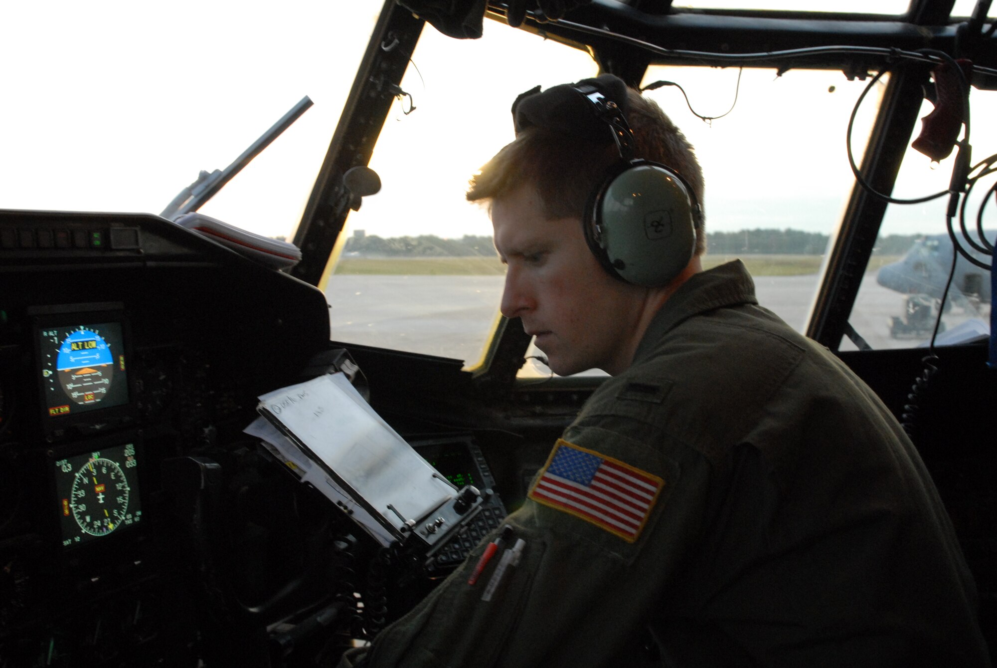 1st Lt. Jay Deas, 50th Airlift Squadron pilot, performs a pre-flight check on a C-130H3 Oct. 27 before a flight in support of a joint force exercise at Pope AFB, N.C. The JFEX focused on cohesive training between the Air Force and Army to reestablish forcible entry capability through air power. (U.S. Air Force photo by Senior Airman Nathan Allen)