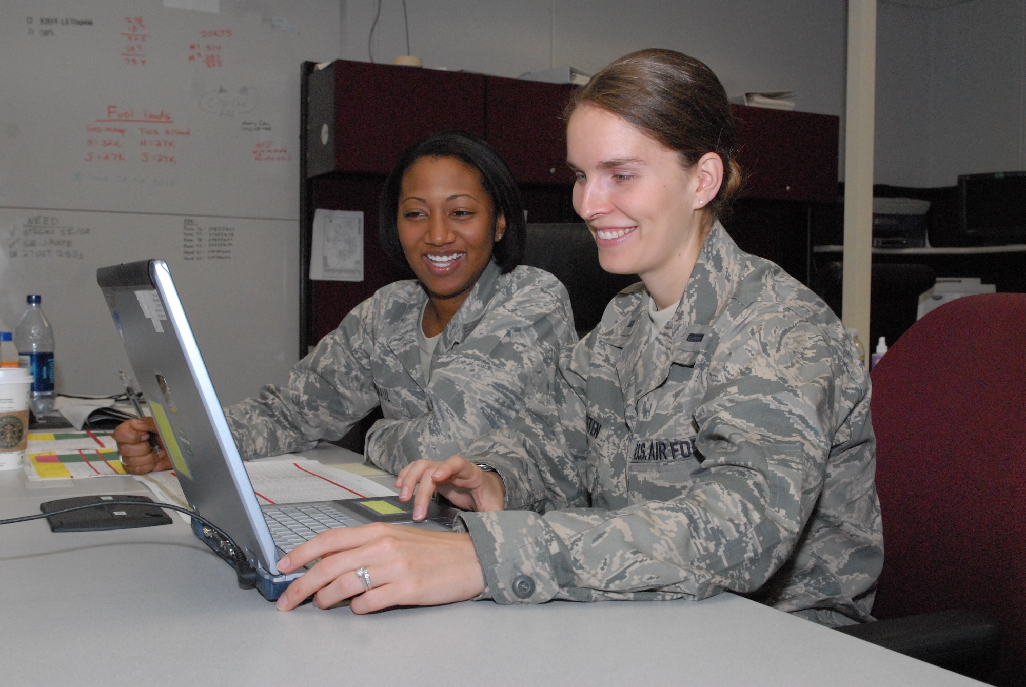 1st Lt. Jill Dvergsten, 50th Airlift Squadron Chief of Intel from Little Rock Air Force Base (right), and 1st Lt. Jocelyn Mitnaul, Deputy Chief of Intelligence for the 437th Airlift Wing at Charleston AFB, S.C., plan an aircrew briefing Oct. 28 as part of a joint force exercise at Pope AFB, NC. The JFEX focused on cohesive training between the Air Force and Army to reestablish forcible entry capability through air power. (U.S. Air Force photo by Senior Airman Nathan Allen)