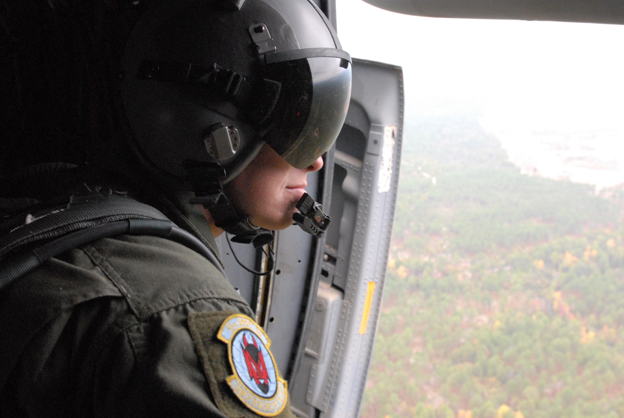 Senior Airman Bart Johnson, 50th Airlift Squadron C-130H3 loadmaster from Little Rock Air Force Base, Ark., surveys the terrain of the “Sicily” drop zone Oct. 27 as part of a joint force exercise at Pope AFB, N.C. The JFEX focused on cohesive training between the Air Force and Army to reestablish forcible entry capability through air power. (U.S. Air Force photo by Senior Airman Nathan Allen)