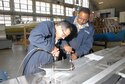 DAYTON, Ohio - Members of the 315th Maintenance Squadron out of Charleston Air Force Base, S.C., work on a stand for the B-17F Memphis Belle&#39;s wing during a two-week stay at Wright-Patterson Air Force Base, Ohio, where the group worked in the restoration hangar at the National Museum of the U.S. Air Force. (U.S. Air Force photo)