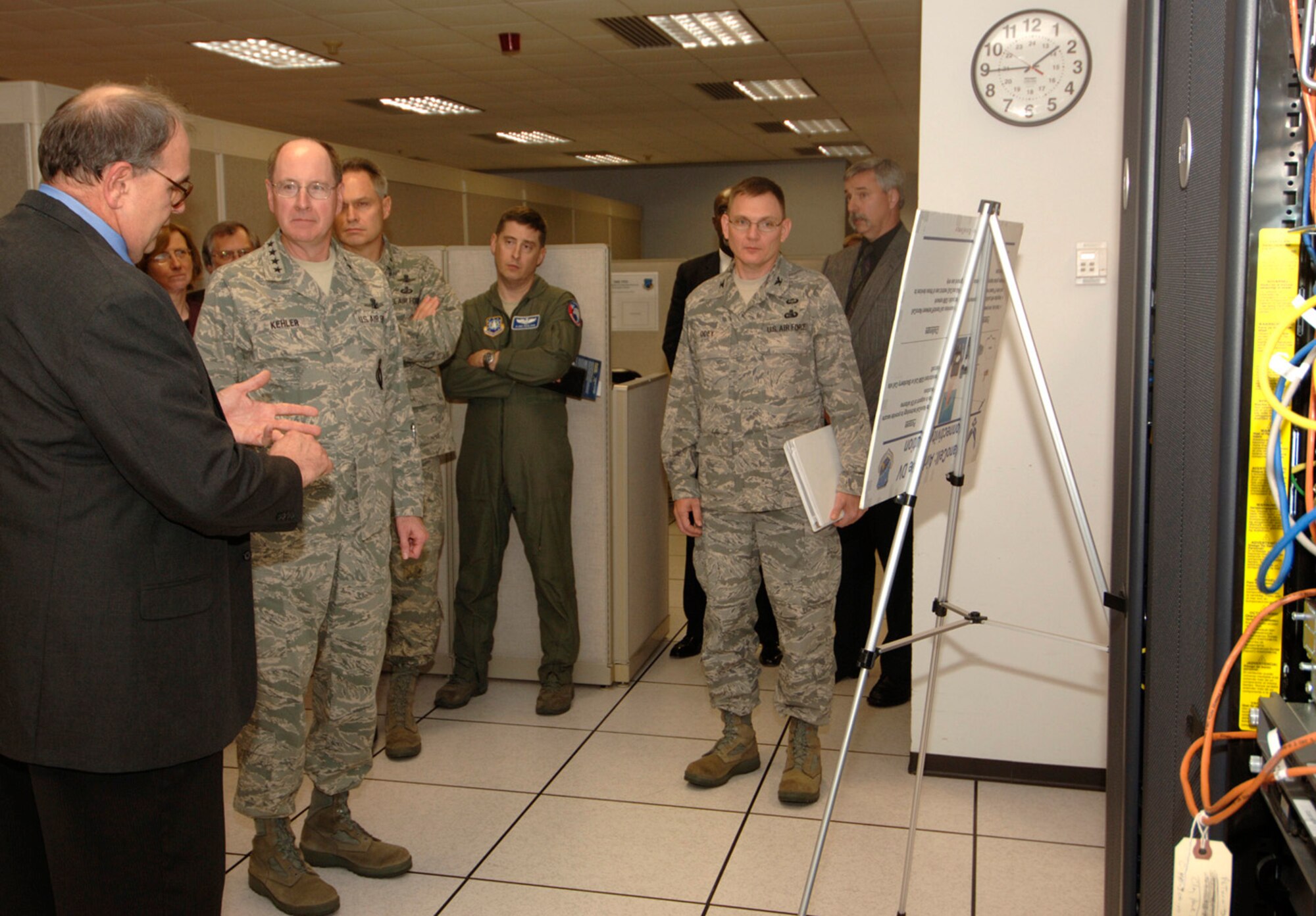 Gen. C. Robert Kehler, commander, Air Force Space Command, receives a
capabilities briefing by Scott Gardner during his recent visit to the Air Force
Network Integration Center at Scott Air Force Base, Ill.  The general and
his senior staff met with AFNIC experts to discuss the progress and
challenges that lay ahead as they continue the reorganization of cyberspace
assets under the command.
