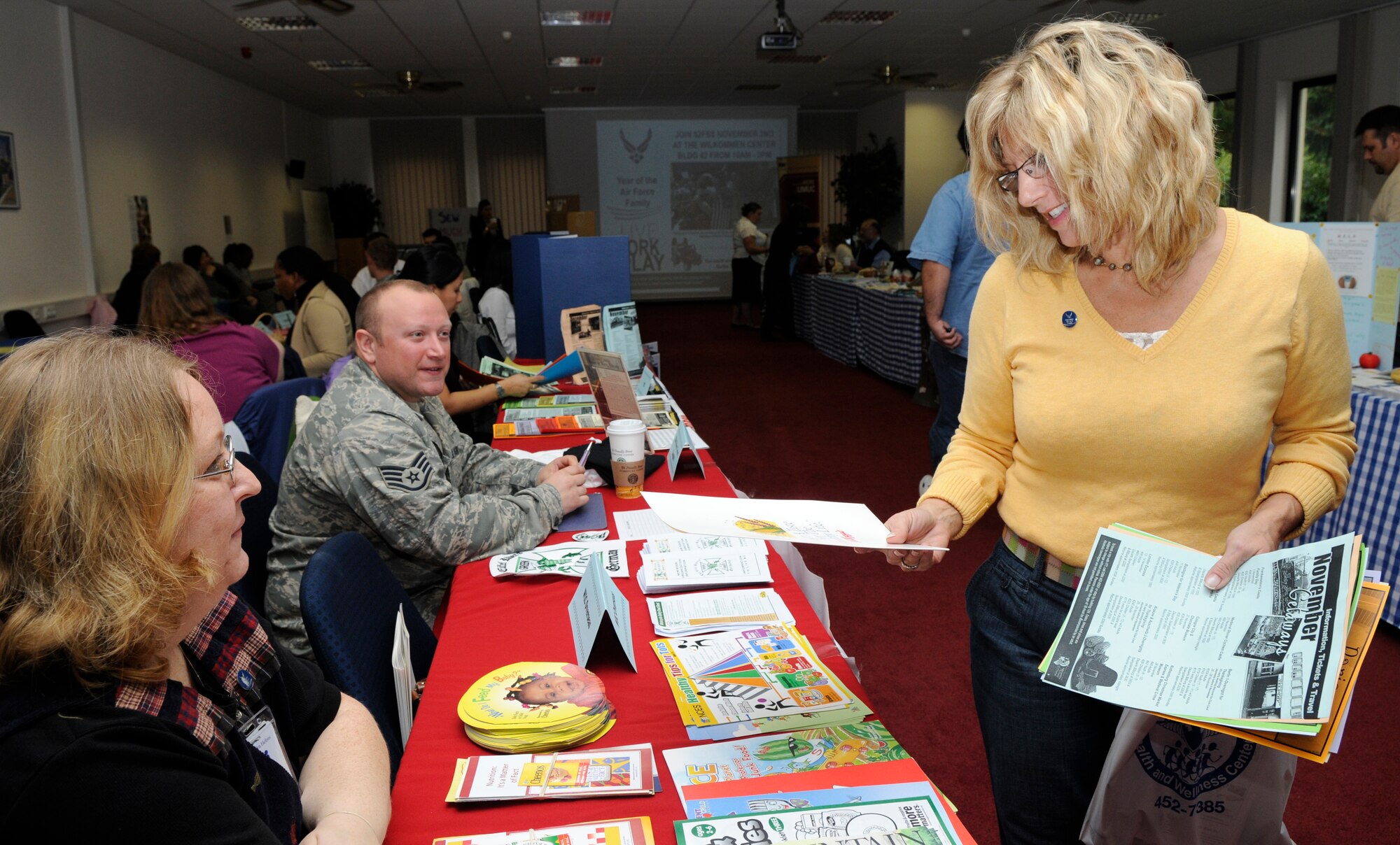 SPANGDAHLEM AIR BASE, Germany –Kelli McCrea, wife of Col. Patrick McCrea, 52nd Operations Group commander, explores the Year of the Air Force Family Information Fair held at the Wilkommen Center Nov. 2. The information fair had about 30 different organizations aimed to support the Air Force family. (U.S. Air Force photo/Airman 1st Class Staci Miller)
