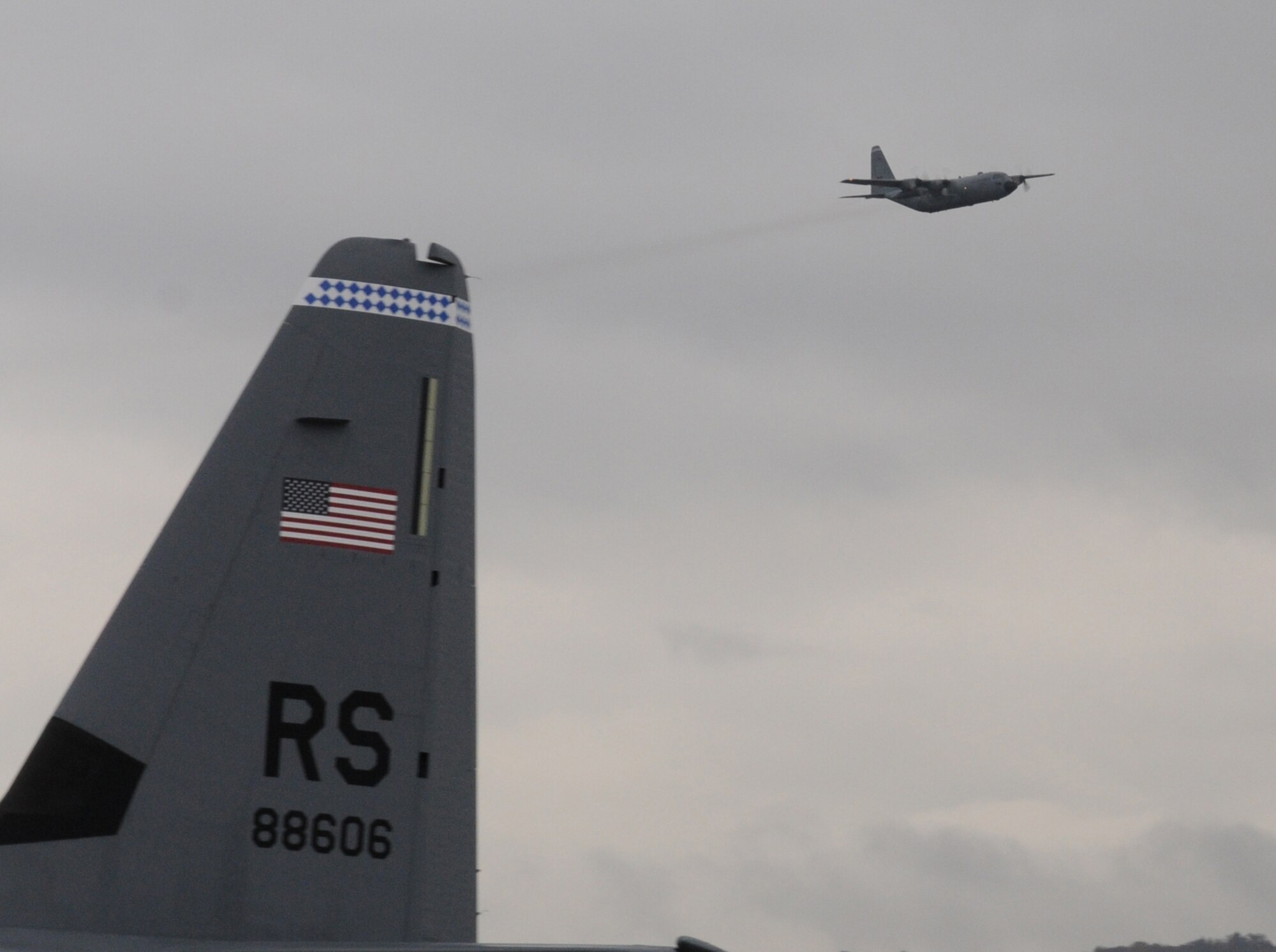 Ramstein Air Base's final C-130E Hercules performs a fly-by over the flightline to conclude its departure ceremony, Ramstein Air Base, Germany, Nov. 2, 2009. The C-130E Hercules has provided more than 40 years of airpower to U.S. Air Forces in Europe, and is being replaced with the new C-130J Super Hercules as part of the revitalization of the Air Force fleet. (U.S. Air Force photo by Airman 1st Class Caleb Pierce)