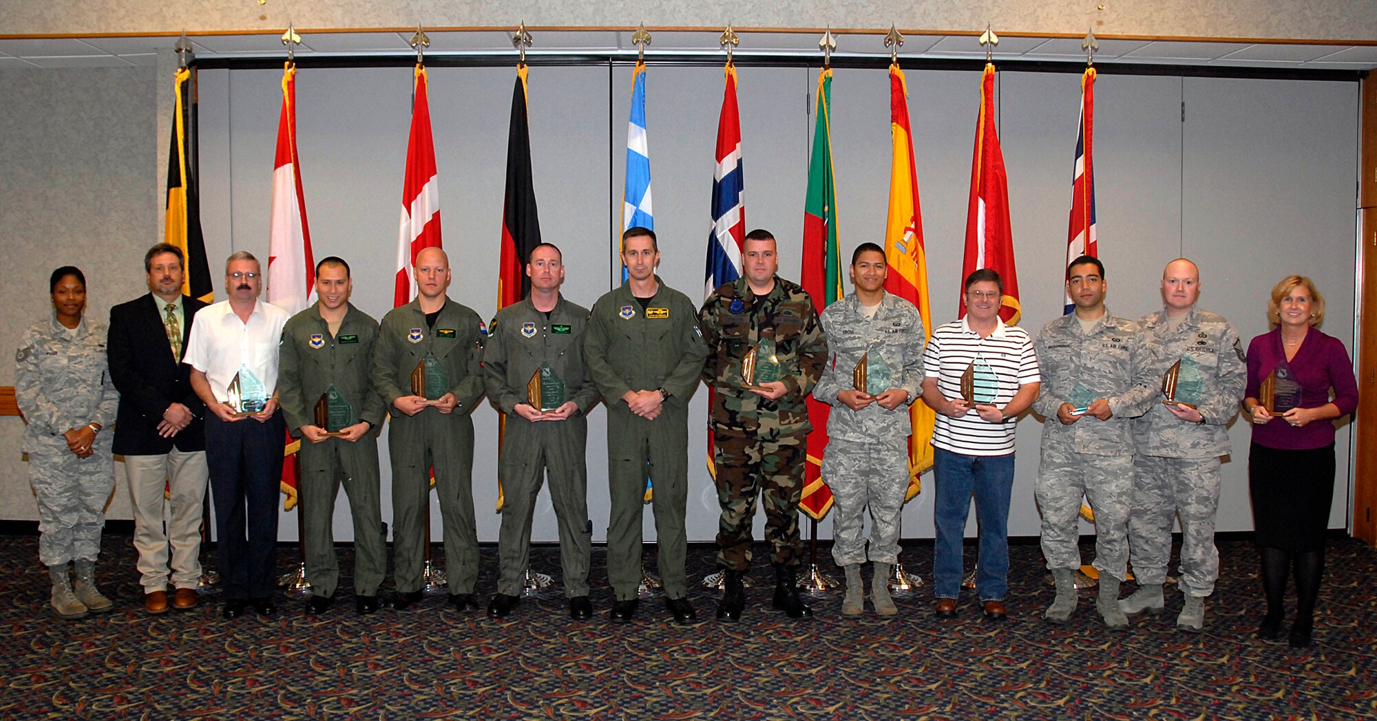 The 80th Flying Training Wing recognized it's quarterly award winners Oct. 25. Those pictured, from left to right, include Tech. Sgt. Mieka Pugh, Air Force Sergeant’s Association representative; Keith Wilson, Embry-Riddle Aeronautical University; Thomas Soderstrom 80th Operations Support Squadron, Civilian of the Quarter, Category III; Capt. John Chapman, 459th Flying Training Squadron, Flight Commander of the Quarter; Lt. Jeffry Kooij, 459th FTS, Company Grade Officer of the Quarter; Maj. Kenneth Cook, 459th FTS, Field Grade Officer of the Quarter; Col. Kevin Schneider, 80th FTW commander; Tech. Sgt. Eric Pentzer, 80th FTW, NCO of the Quarter; Airman 1st Class Hugh Cross, 80th OSS, Airman of the Quarter; Mark Bice, 80th OSS, Civilian of the Quarter, Category I;  Airman 1st Class Carlos Morales, 80th OSS, Dorm Room of the Quarter; Master Sgt. Kevin Gallemore, 80th OSS, Senior NCO of the Quarter; and Michele Houck, 80th FTW, Civilian of the Quarter, Category II. Not pictured is Capt. Jacob Hostetler, 459th FTS, Instructor Pilot of the Quarter. (U.S. Air Force photo/Harry Tonemah)