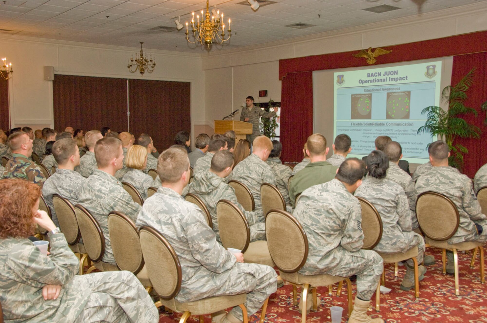 Capt. Scott Carstetter, 653d Electronic Systems Group, tells the audience at the Oct. 29 Heritage of Freedom Forum about efforts to develop and quickly deploy the Battlefield Airborne Communications Node. Col. William Andrews, who was shot down and taken prisoner of war during Desert Storm, and Senior Master Sgt. Raul Ruiz, ESC and 66 ABW First Sergeant, also addressed the forum.  (USAF Photo: Mark Herlihy)