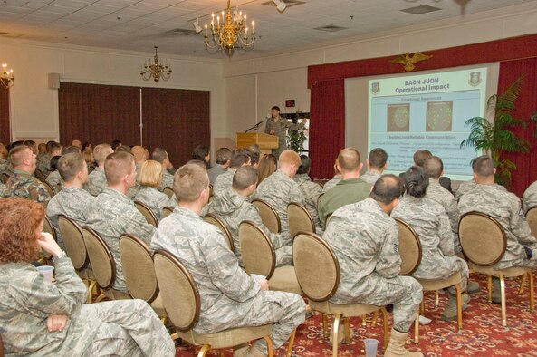 Capt. Scott Carstetter, 653d Electronic Systems Group, tells the audience at the Oct. 29 Heritage of Freedom Forum about efforts to develop and quickly deploy the Battlefield Airborne Communications Node. Col. William Andrews, who was shot down and taken prisoner of war during Desert Storm, and Senior Master Sgt. Raul Ruiz, ESC and 66 ABW First Sergeant, also addressed the forum. (Air Force photo by Mark Herlihy) 