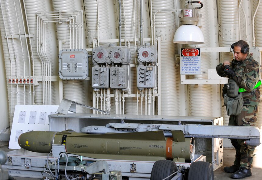 Senior Airman Andre James examines a part belonging to a maverick missile, prepping it to be loaded onto an aircraft in a 25th Fighter Squadron hangar during exercise Beverly Midnight 09-02 on Osan Air Base, Nov. 2. (U.S. Air Force photo/ Senior Airman Stephenie Wade)