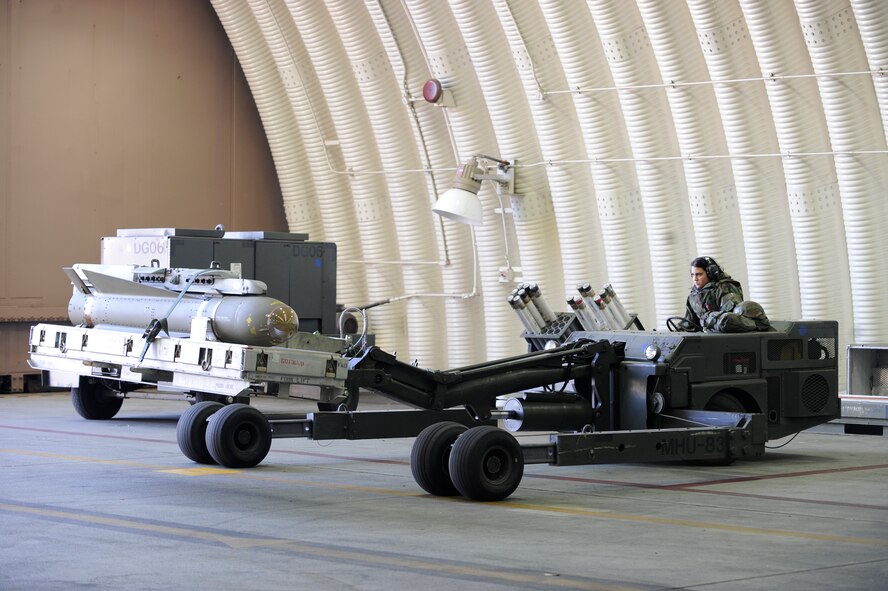 Airman 1st Class Heather Perez transports a maverick missile to an aircraft in a 25th Fighter Squadron hangar during exercise Beverly Midnight 09-02 on Osan Air Base, Nov. 2. (U.S. Air Force photo/Senior Airman Stephenie Wade)