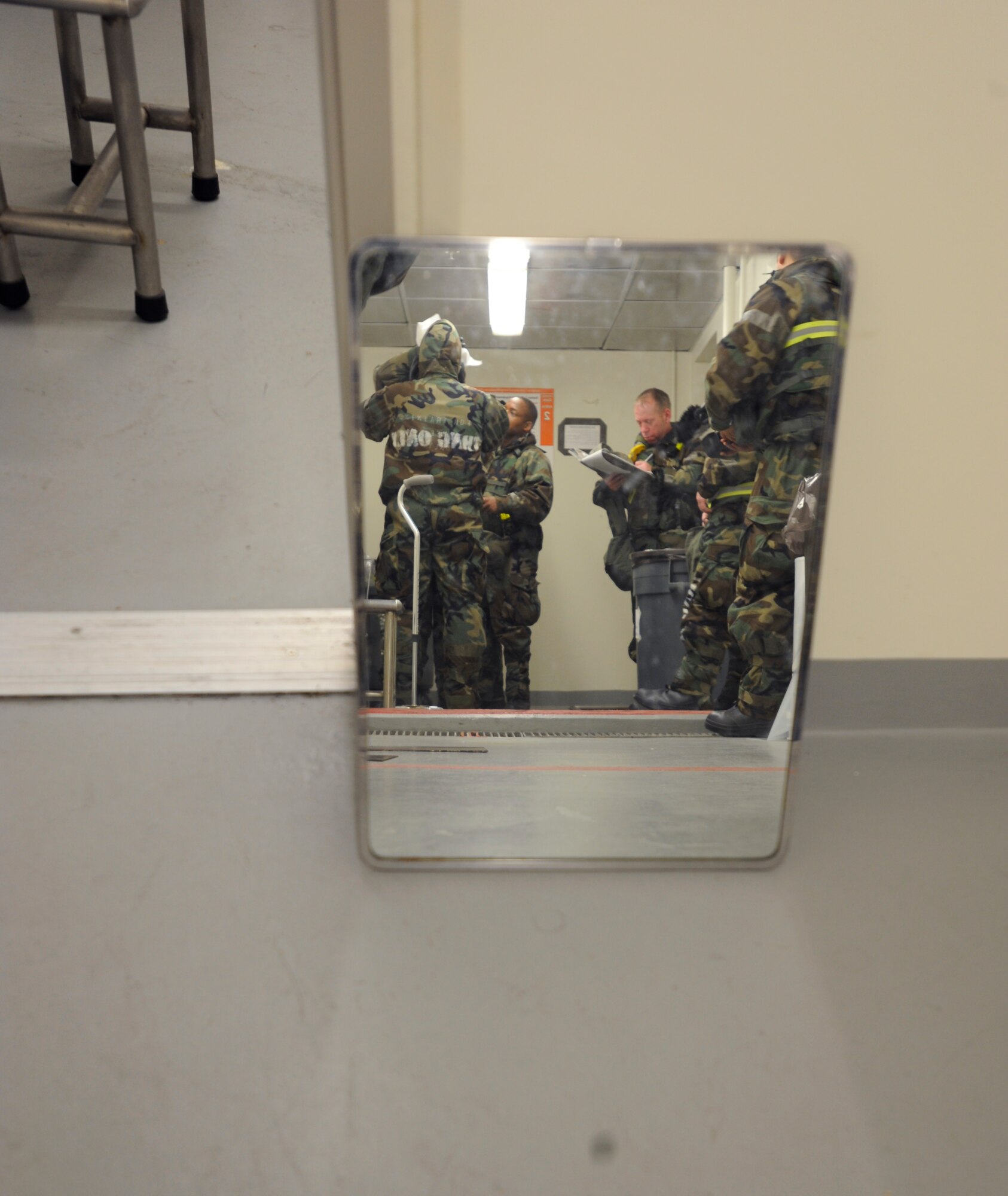 Two Airmen go through the ground decontamination scenario for the first time at the 25th Fighter Squadron during exercise Beverly Midnight 09-02 on Osan Air Base, Nov. 2. (U.S. Air Force photo/Senior Airman Stephenie Wade)