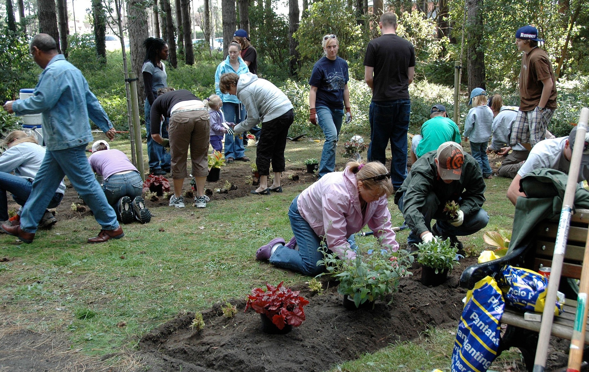 RAF MILDENHALL, England -- Families from RAFs Mildenhall and Lakenheath volunteer to construct the Veteran's Remembrance Garden near Heritage Park here Aug. 28. The project was organized by the RAF Mildenhall American Red Cross Station as part of President Barack Obama's United We Serve initiative. The president urged Americans earlier this summer to become involved in their communities. (Courtesy photo)