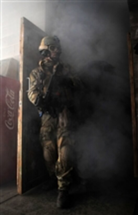 A U.S. Air Force pararescueman takes up a security position during a training scenario at a U.S. location during exercise Patriot Archangel on Oct. 17, 2009.  The exercise hones Guardian Angel combat operations in simulated hostile urban environments and increases combat effectiveness for pararescuemen.  