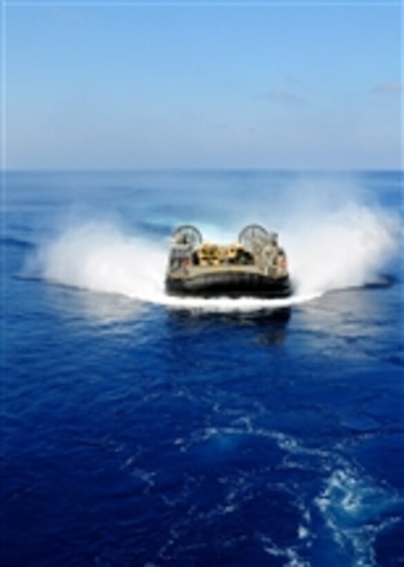 A U.S. Navy landing craft, air cushion from Assault Craft Unit 4 prepares to enter the well deck of the multipurpose amphibious assault ship USS Bataan (LHD 5) during Exercise Bright Star 2009 in the Mediterranean Sea on Oct. 12, 2009.  Bright Star is a biennial, multinational exercise designed to improve readiness, interoperability and the military and professional relationships among U.S., Egyptian and other participating forces.  