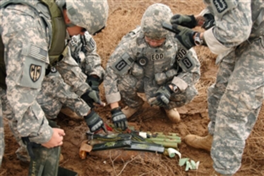 U.S. soldiers prepare old munitions for destruction during controlled detonation operations on Forward Operating Base Delta in southern Iraq, Oct. 31, 2009. The 789th Explosive Ordinance Disposal Company conducts controlled detonations to destroy munitions seized in raids and those found in weapons caches.