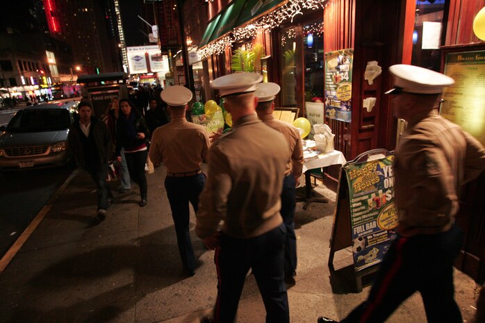 Marines from Special Purpose Marine Air Ground Task Force 26 walk out into New York on their first night of liberty, Nov. 2. The Marines came into town aboard the USS New York to participate in the commissioning ceremony and other community outreach events this week. The ship is constructed from seven and a half tons of steel salvaged from the World Trade Center towers. (Official Marine Corps photo by Sgt. Randall A. Clinton)