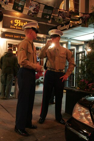 Lance Cpl. Jordan Wheeler, machine gunner, 2nd Battalion, 9th Marine Regiment, Special Purpose Marine Air Ground Task Force 26, and Cpl. Nick Collins, machine gunner, 2/9, SPMAGTF-26, wait outside a restaurant in New York, Nov. 2. Wheeler, a Washington, Pa., native, and Collins, from Orlando, Fla., came to the city with the USS New York and will be participating in the commissioning ceremony and other community outreach events this week. The ship is constructed from seven and a half tons of steel salvaged from the World Trade Center towers. (Official Marine Corps photo by Sgt. Randall A. Clinton)