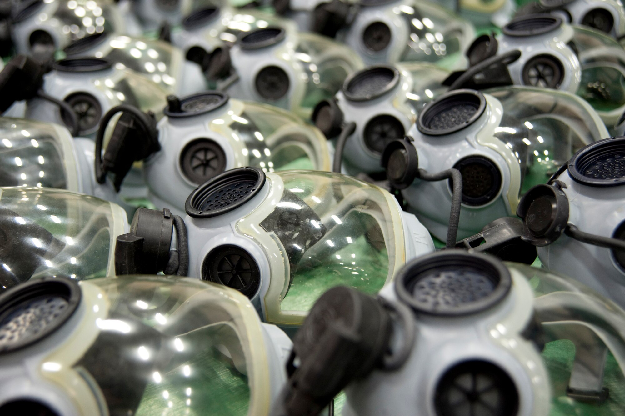MISAWA AIR BASE, Japan -- Dozens of MCU-2A/P gas masks lie in a basin after being washed and turned in at the 35th Logistics Readiness Squadron supply warehouse Nov. 3. The masks were redistributed to Defense Department organizations that still use this type of mask. (U.S. Air Force photo/Staff Sgt. Samuel Morse)