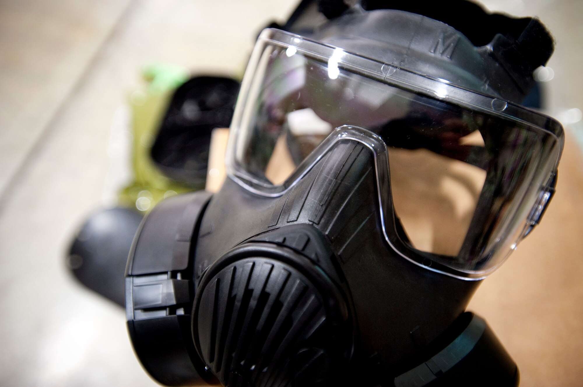 MISAWA AIR BASE, Japan -- A new M-50 Joint Service General Purpose Mask sits on its carton at the 35th Logistics Readiness Squadron supply warehouse Oct. 27. The new masks replace the MCU-2A/P mask and offer more sustainable protection as well as increased comfort for the wearer. (U.S. Air Force photo/Staff Sgt. Samuel Morse)