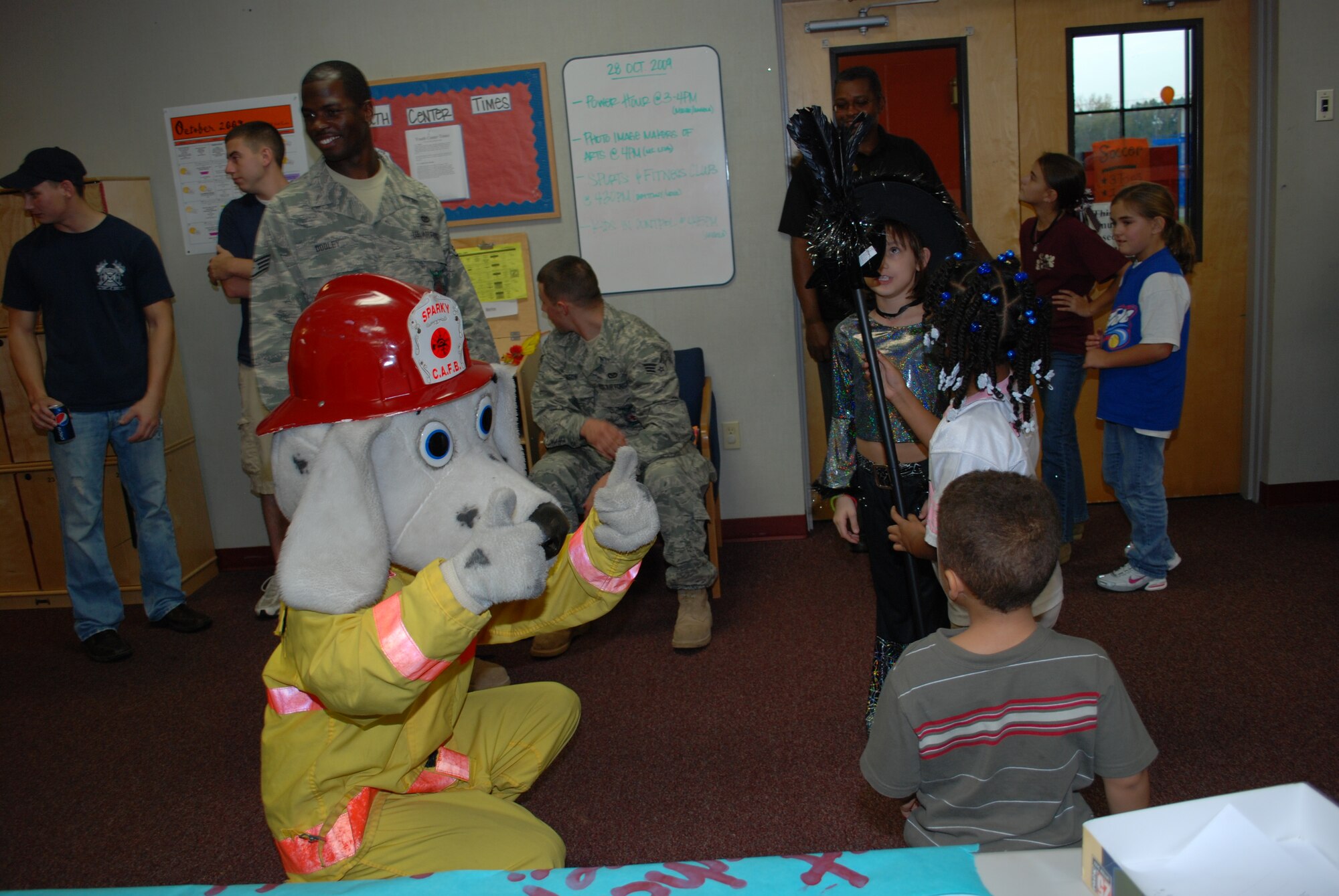 Sparky, the fire dog, interacts with children during the Youth Center's
Fall Festival Thursday. Over 100 children and family members attended the
event at the Columbus AFB Youth Center. (U.S. Air Force photo/Pam Wickham)
