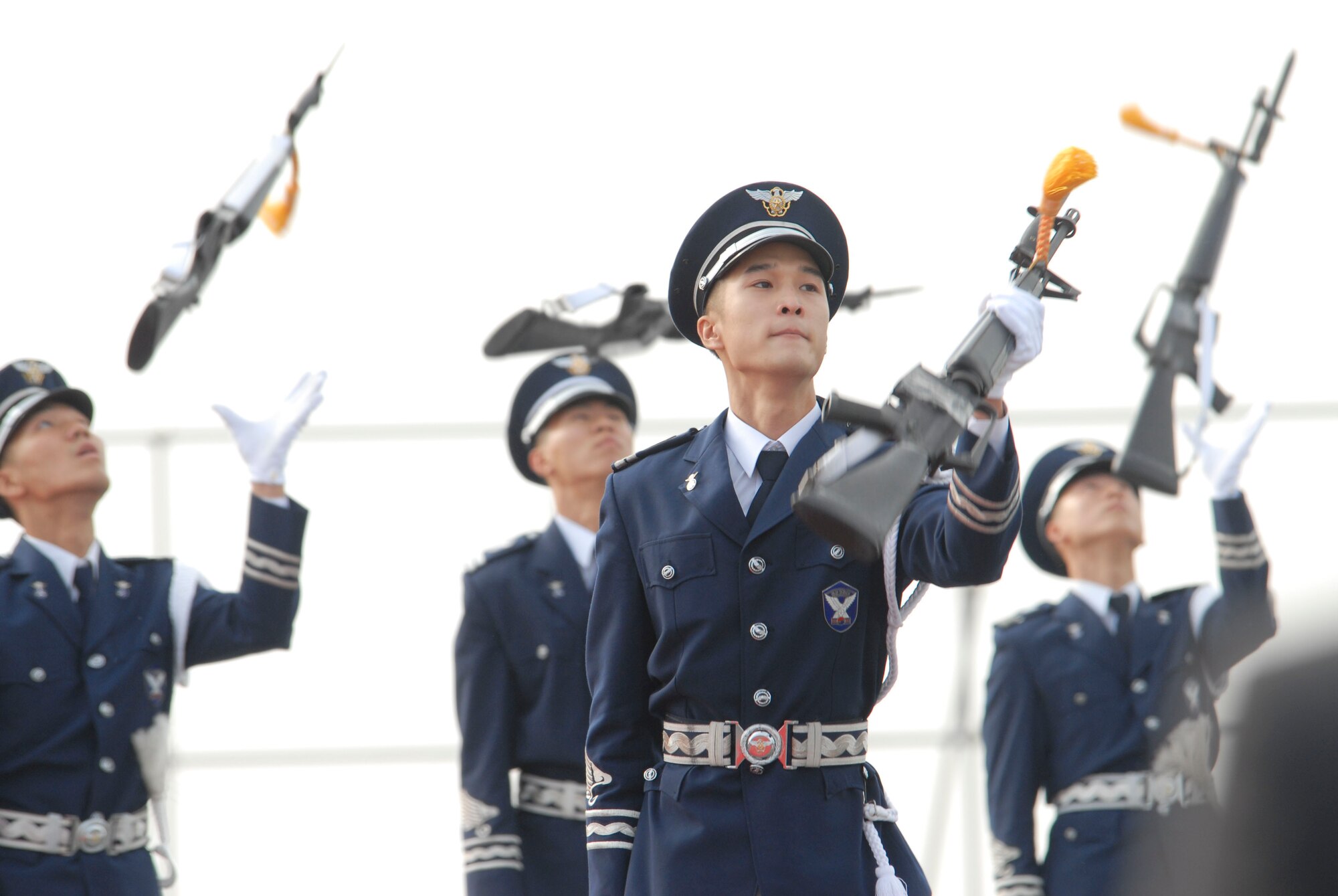 KUNSAN AIR BASE, Republic of Korea -- The Republic of Korea Air Force Honor Guard catches their rifles during the opening ceremony of the Gunsan Saemangeum Airshow in Gunsan City. The City of Gunsan, 8th Fighter Wing and Republic of Korea Air Forces' 38th Fighter Group hosted the air show, Oct. 31. (U.S. Air Force photo/Staff Sgt. Darnell T. Cannady)