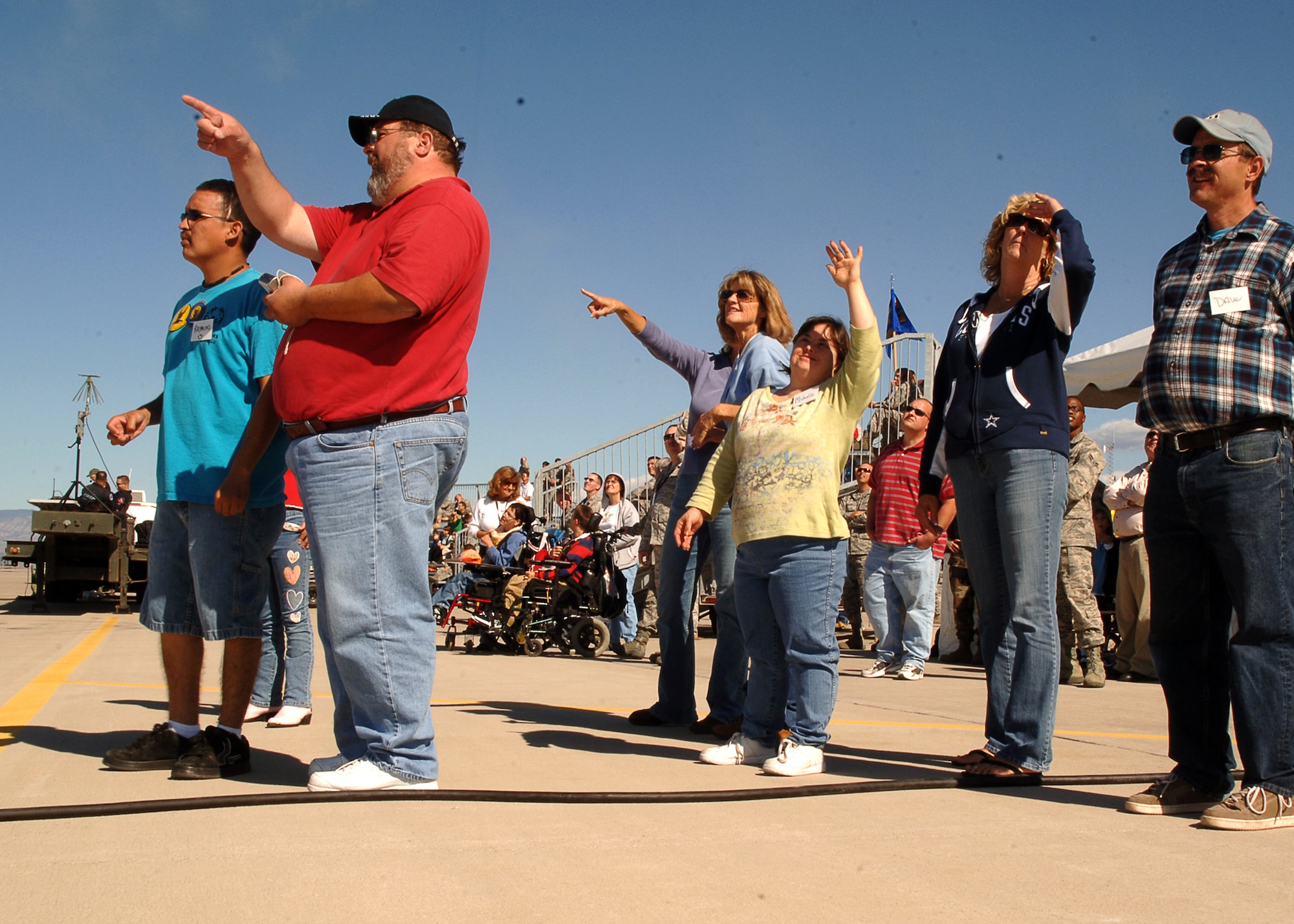 HOLLOMAN AIR FORCE BASE, N.M. -- Special guests to the base from Zia Therapy Center and Otero County Special Olympics were treated to an exclusive air show, open only to base personnel, Oct. 23 here, after they toured the Holloman Fire Department and an F-22A Raptor. All the group members said they enjoyed the day with the Air Force and look forward to getting another opportunity to visit the base. (U.S. Air Force photo by Staff Sgt. Sanjay Allen)