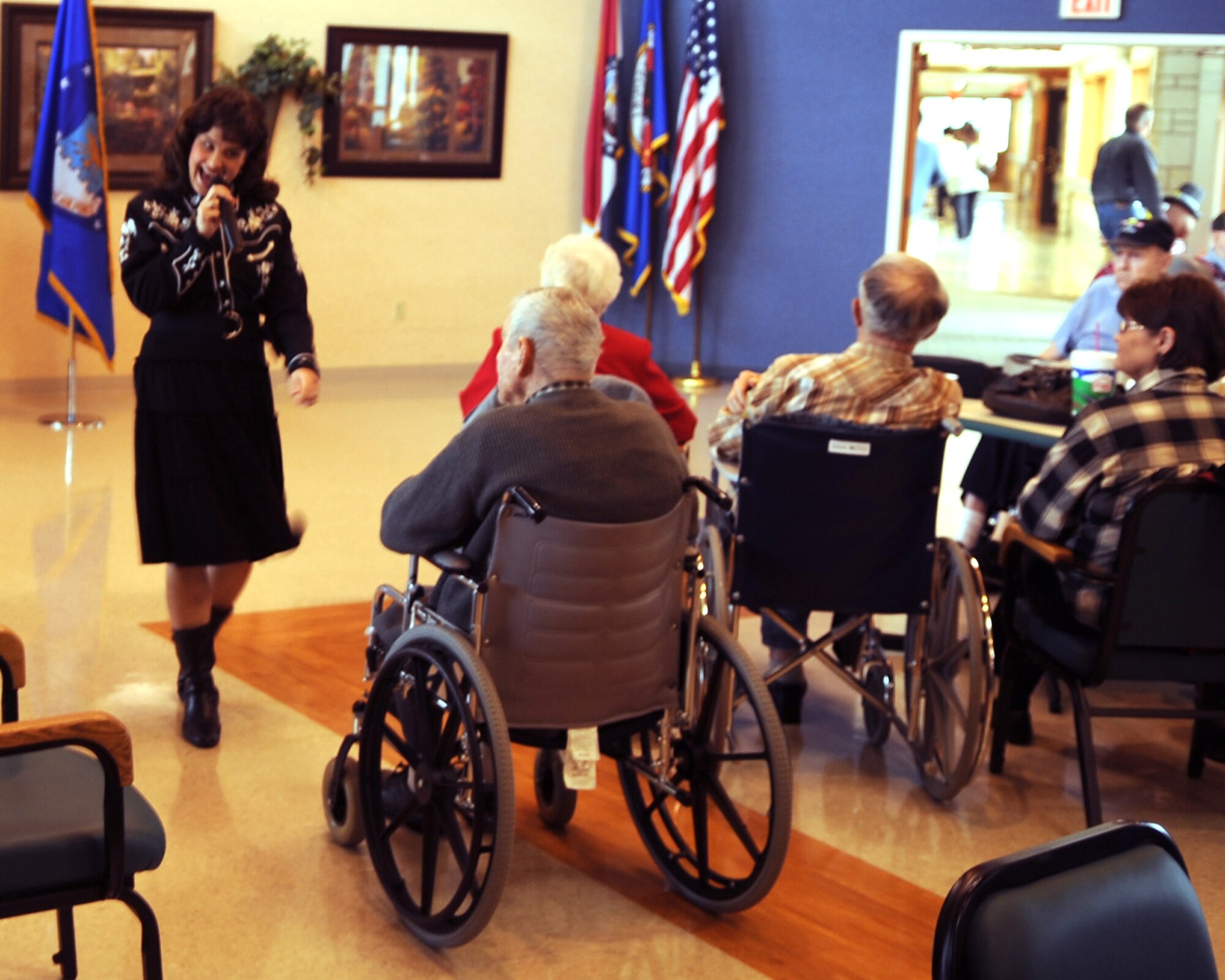 WHITEMAN AIR FORCE BASE, Mo. -- Julie Curtis, a speech pathologist at Whiteman Elementary, performs her rendition of "Crazy," at the Missouri Veteran's Home Tuesday.  Volunteers from Whiteman Air Force Base put on a two-hour show consisting of singing, dancing and entertainment for the veterans in Warrensburg, Mo.
(U.S. Air Force Photo/Airman 1st Class Torey Griffith)
(released)
