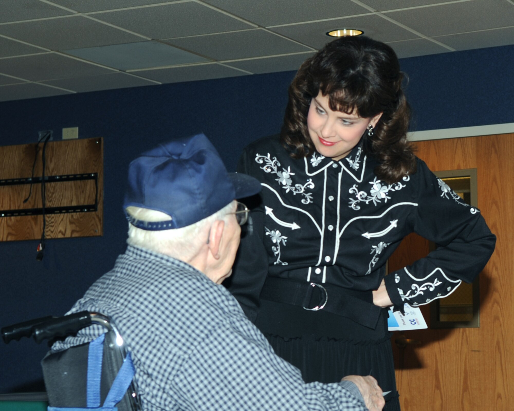 WHITEMAN AIR FORCE BASE, Mo. -- Julie Curtis, a speech pathologist at Whiteman Elementary, performs her rendition of "Crazy," at the Missouri Veteran's Home Tuesday.  Volunteers from Whiteman Air Force Base put on a two-hour show consisting of singing, dancing and entertainment for the veterans in Warrensburg, Mo.
(U.S. Air Force Photo/Airman 1st Class Torey Griffith)
(released)
