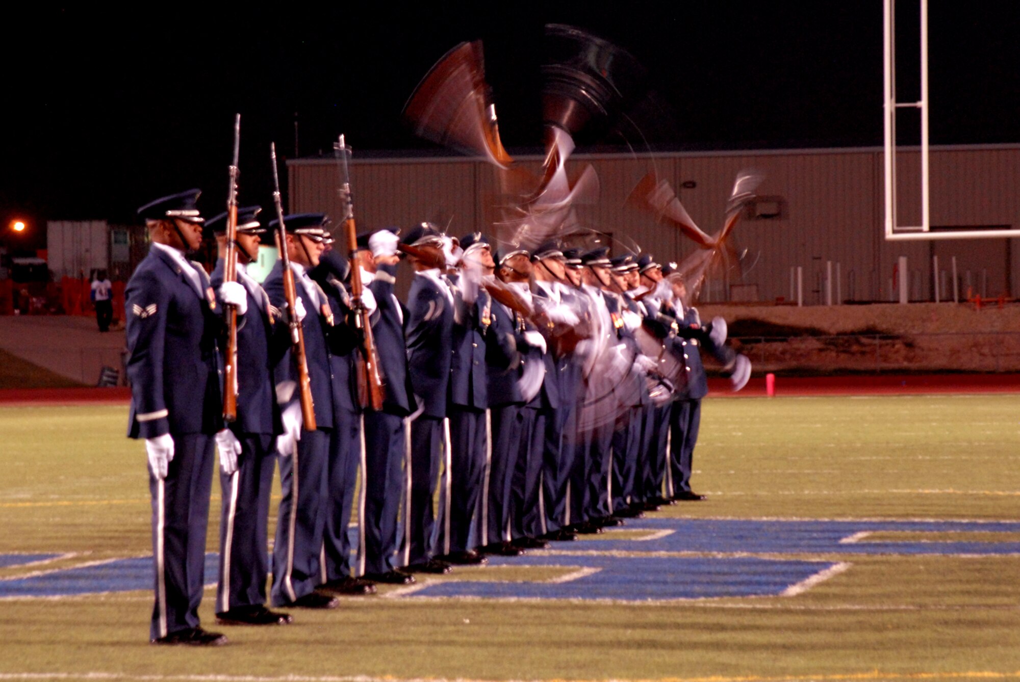 The U.S. Air Force Honor Guard Drill Team performs for the crowd during the Angelo State University football game half-time show, Oct. 31, 2009. The Drill Team is the traveling component of the U.S. Air Force Honor Guard and tours worldwide representing all Airmen while showcasing Air Force precision and professionalism. (U.S. Air Force photo/Staff Sgt. Laura R. McFarlane)