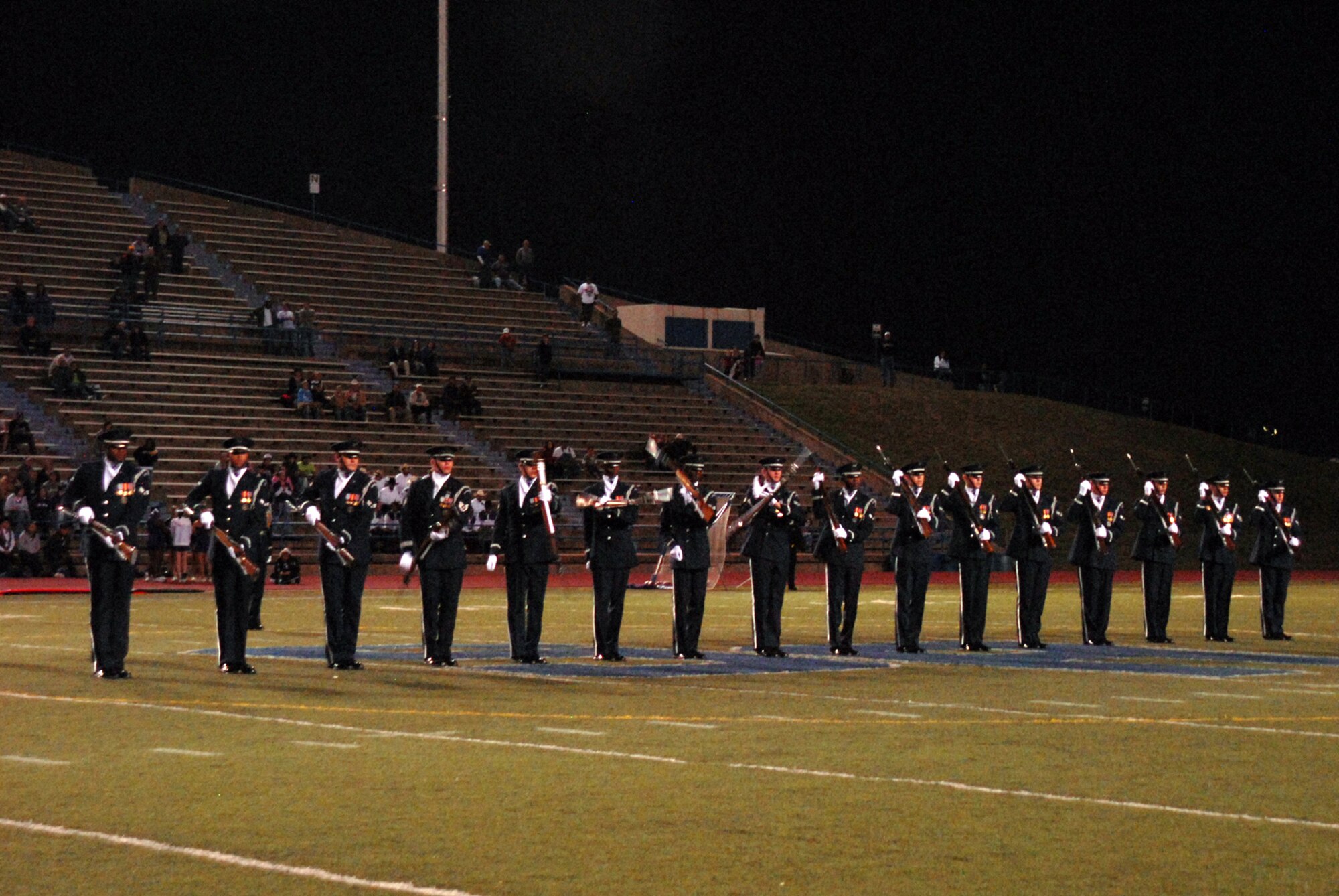 The U.S. Air Force Honor Guard Drill Team performs for the crowd during the Angelo State University football game half-time show, Oct. 31, 2009. The Drill Team is the traveling component of the U.S. Air Force Honor Guard and tours worldwide representing all Airmen while showcasing Air Force precision and professionalism. (U.S. Air Force photo/Staff Sgt. Laura R. McFarlane)