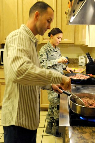 LAS VEGAS-- Tech. Sgt. Rob Mediavilla, 99th Logistics Readiness Squadron, and Staff Sgt. Tiffany Caguitla, 57th Adversary Tactics Group, cook ground beef for a dinner at the Ronald McDonald House in Las Vegas Oct. 28, 2009. Several Nellis and Creech 5/6 members volunteer at the Ronald McDonald House twice a month.
(U.S. Air Force Photo by Airman 1st Class Jamie Nicley)