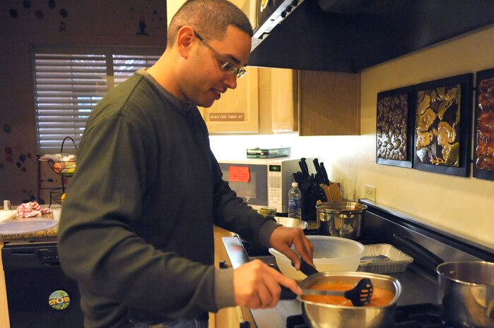 LAS VEGAS-- Staff Sgt. Antonio Gueitz, 99th Comptroller Squadron,  prepares rice for a dinner at the Ronald McDonald House in Las Vegas Oct. 28, 2009. Several Nellis and Creech 5/6 members volunteer at the Ronald McDonald House twice a month.
 (U.S. Air Force Photo by Airman 1st Class Jamie Nicley)