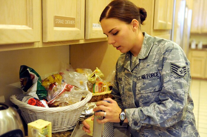 LAS VEGAS-- Staff Sgt. Tiffany Caguitla, 57th Adversary Tactics Group, grates cheese in preparation for a dinner at the Ronald McDonald House in Las Vegas Oct. 28, 2009. Several Nellis and Creech 5/6 members volunteer at the Ronald McDonald House twice a month.
(U.S. Air Force Photo by Airman 1st Class Jamie Nicley)