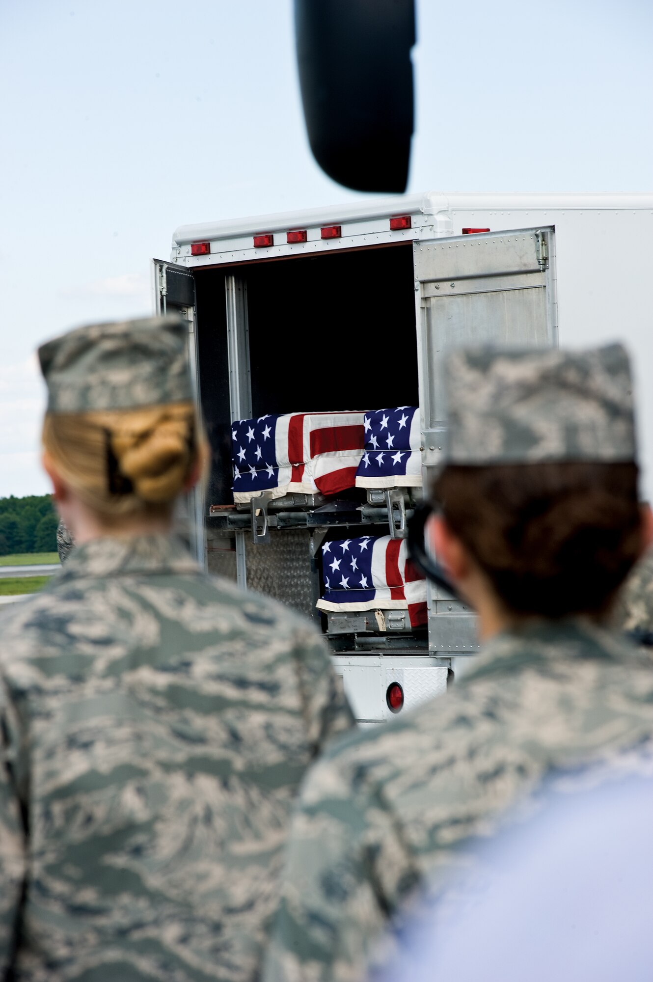 Seven fallen heroes arrived at Dover Air Force Base, Del., July 8, 2009. They were transferred to the Air Force Mortuary Affairs Operations Center where they were processed and prepared for transport to their final destination. (DoD photo/Benjamin Faske)