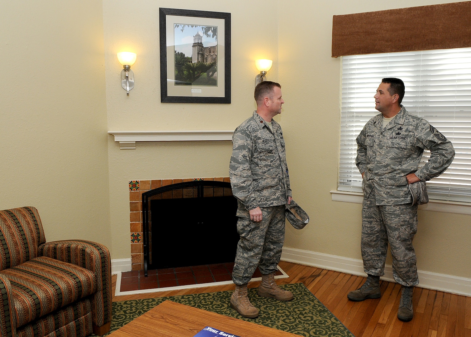 Maj. Todd Alcott, left, Air Force loding chief, and Chief Master Sgt. Max Grindstaff, 12th Flying Training Wing command chief, visit a newly renovated Temporary Lodging Facility, following a Nov. 3 ribbon cutting ceremony at Randolph Air Force Base. (U.S. Air Force photo by David Terry)
